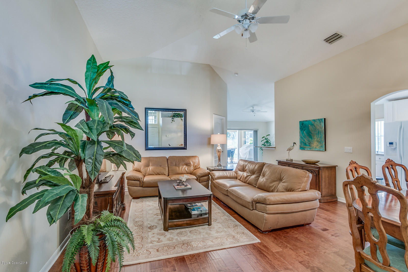 1253 Foxridge Place Melbourne, FL 32940 - Photo 7 of 22 a living room with furniture and a potted plant