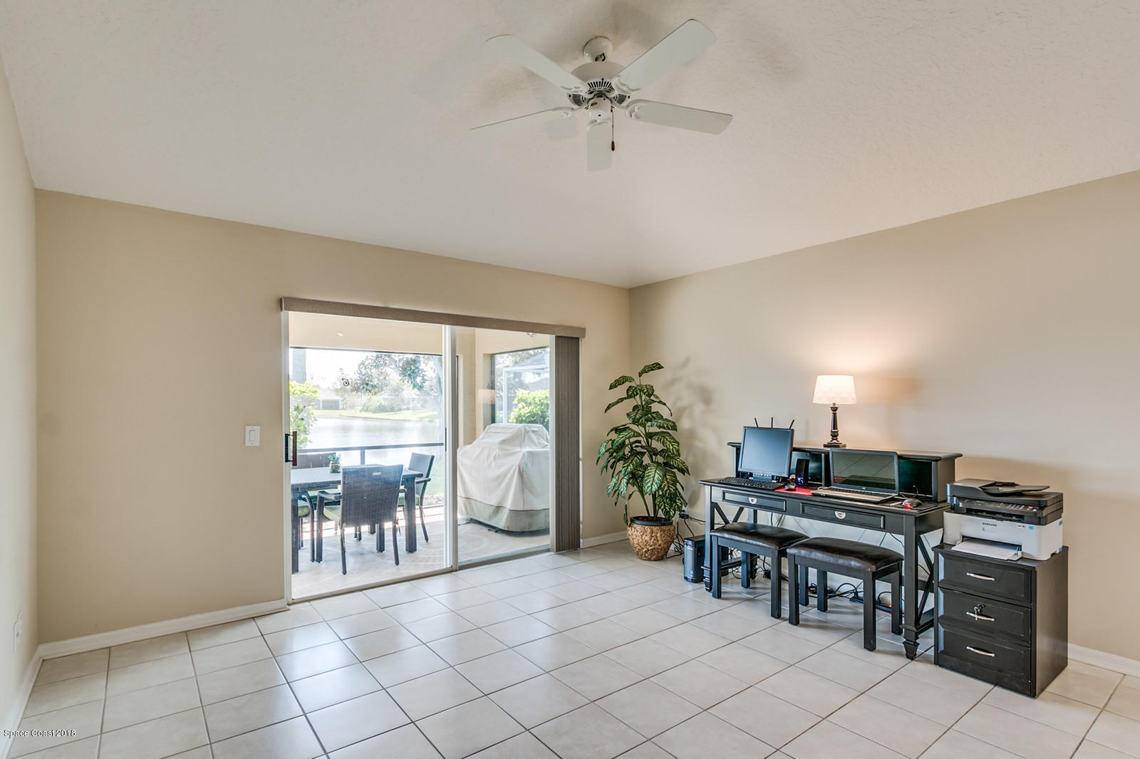 1253 Foxridge Place Melbourne, FL 32940 - Photo 10 of 22 a livingroom with furniture and a flat screen tv
