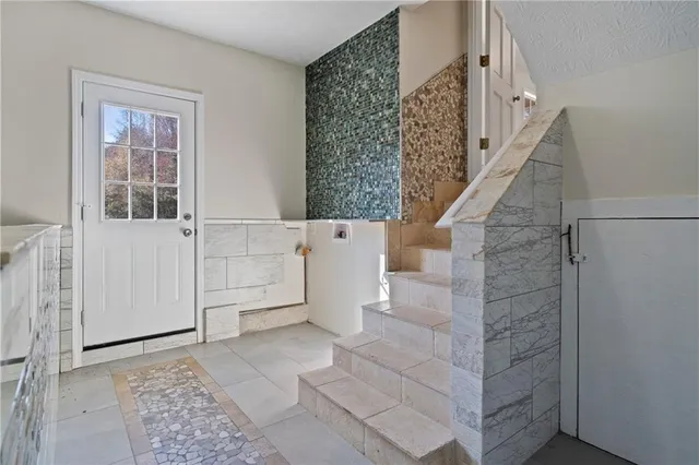 a view of entryway with stairs