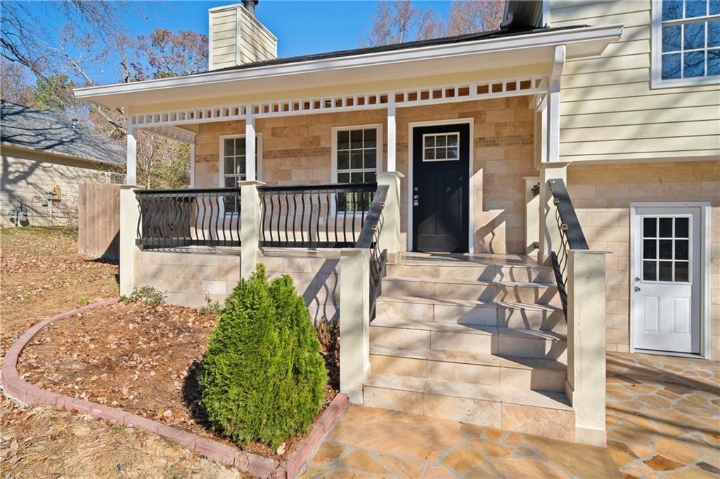 3323 Old Oaks Road Buford, GA 30519 - Photo 3 of 24 a view of a house with a porch