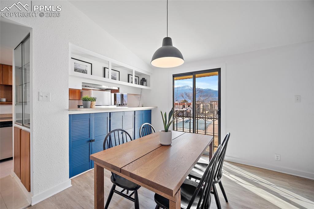 1010 Fontmore Road, Unit D Colorado Springs, CO 80904 - Photo 14 of 43 a view of a dining room with furniture and a chandelier