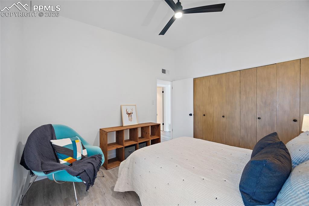 1010 Fontmore Road, Unit D Colorado Springs, CO 80904 - Photo 25 of 43 a bedroom with a bed a desk and chair