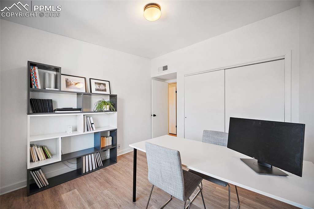 1010 Fontmore Road, Unit D Colorado Springs, CO 80904 - Photo 26 of 43 a view of a livingroom with furniture and a bookshelf