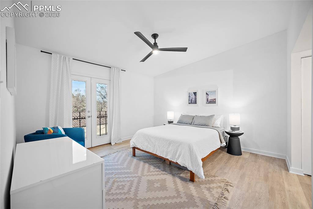 1010 Fontmore Road, Unit D Colorado Springs, CO 80904 - Photo 28 of 43 a bedroom with a bed and a table