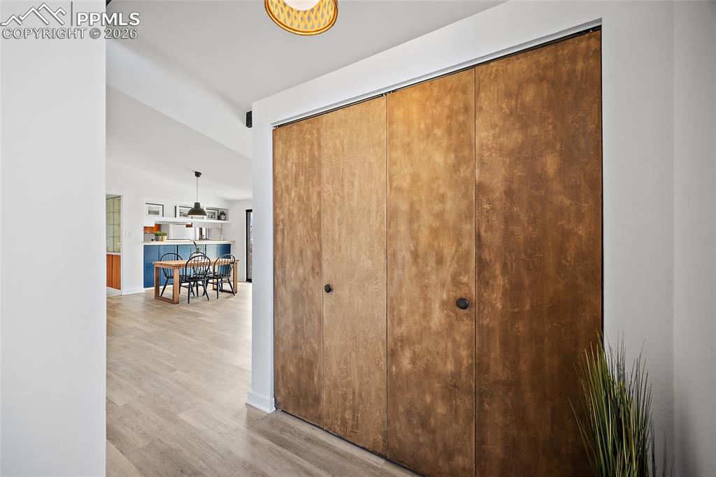 1010 Fontmore Road, Unit D Colorado Springs, CO 80904 - Photo 3 of 43 a view of a hallway with wooden floor and dining room