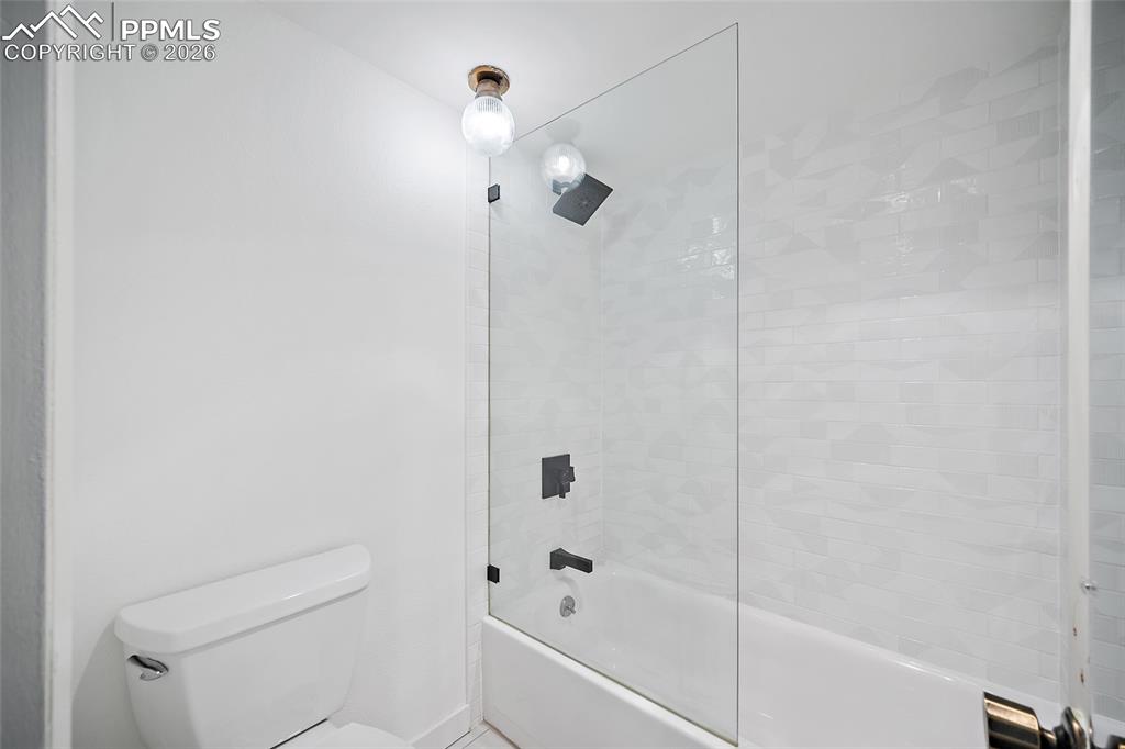 1010 Fontmore Road, Unit D Colorado Springs, CO 80904 - Photo 32 of 43 a bathroom with a bathtub and a shower