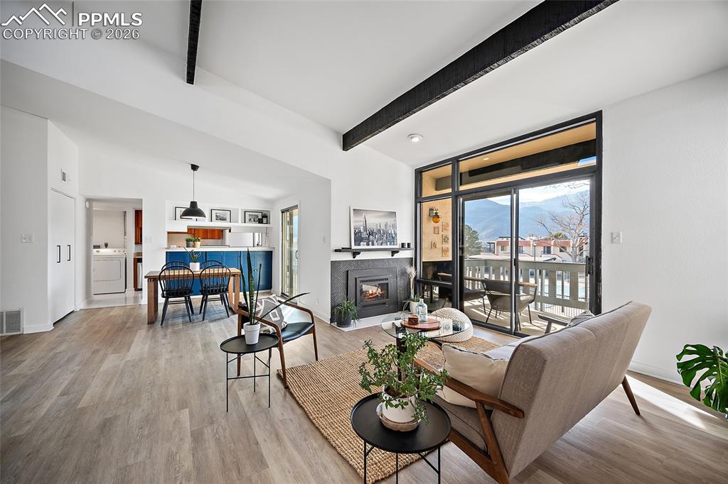 1010 Fontmore Road, Unit D Colorado Springs, CO 80904 - Photo 5 of 43 a living room with furniture and wooden floor