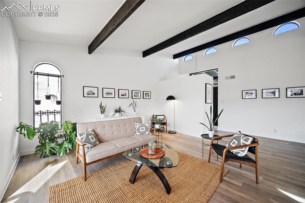 1010 Fontmore Road, Unit D Colorado Springs, CO 80904 - Photo 6 of 43 a living room with furniture and wooden floor