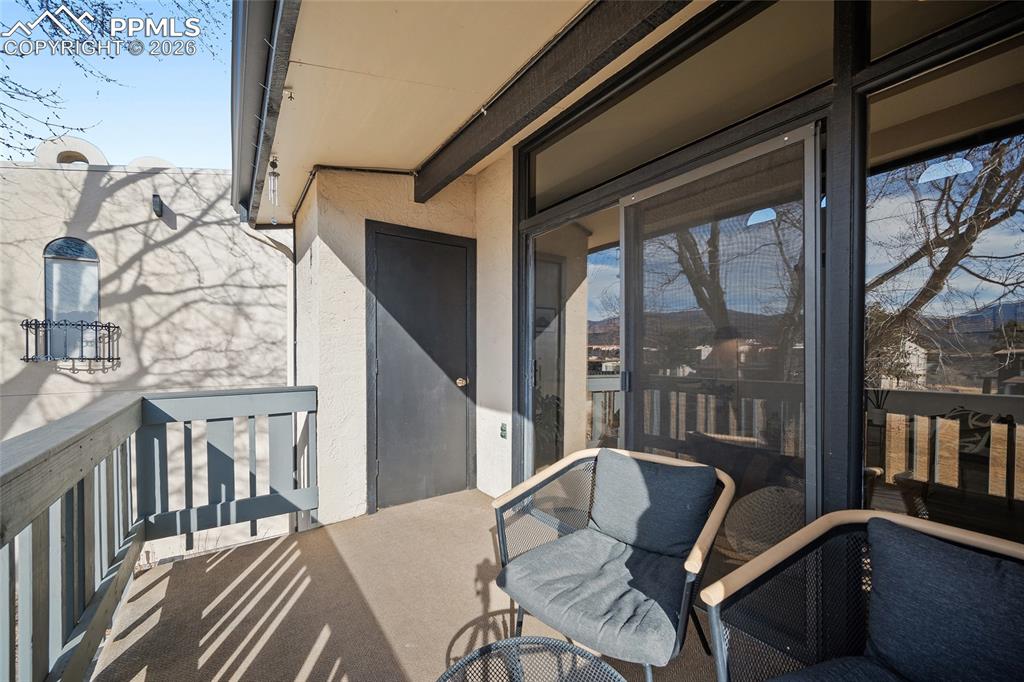 1010 Fontmore Road, Unit D Colorado Springs, CO 80904 - Photo 8 of 43 a balcony with table and chairs