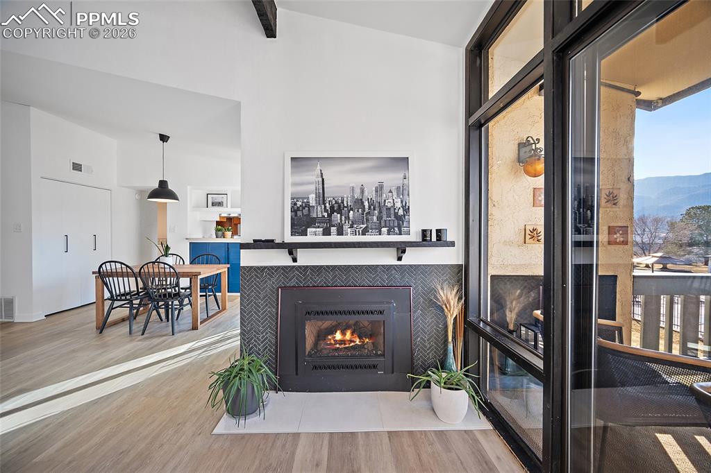 1010 Fontmore Road, Unit D Colorado Springs, CO 80904 - Photo 10 of 43 a living room with furniture a fireplace and a table