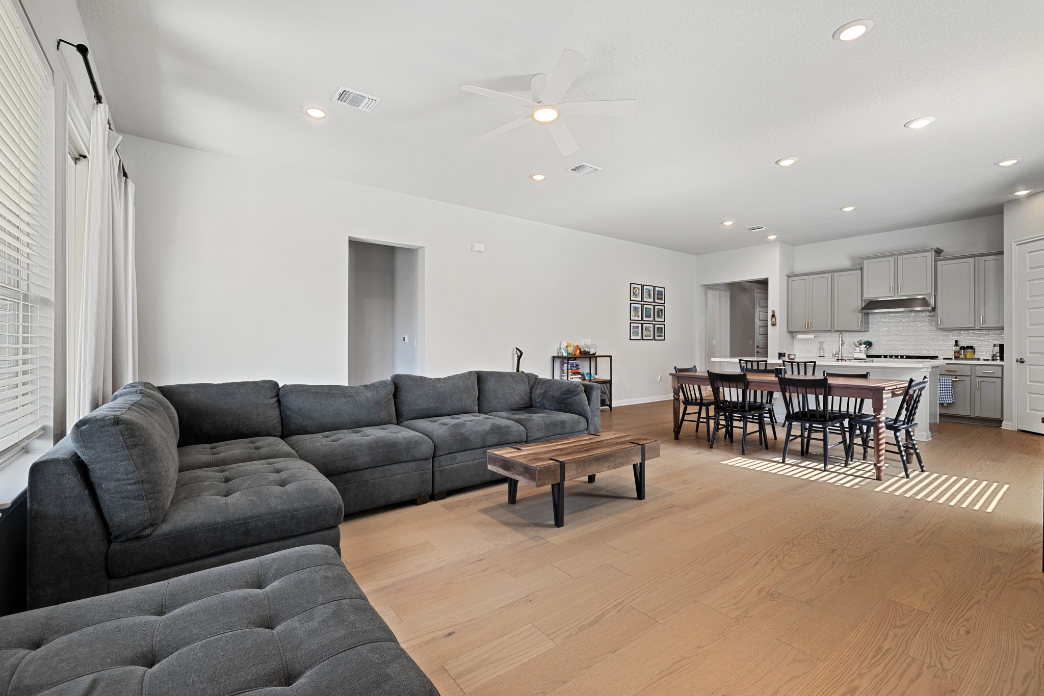 8405 Hubble Walk Austin, TX 78744 - Photo 11 of 36 Living room featuring a ceiling fan, light wood finished floors, and recessed lighting