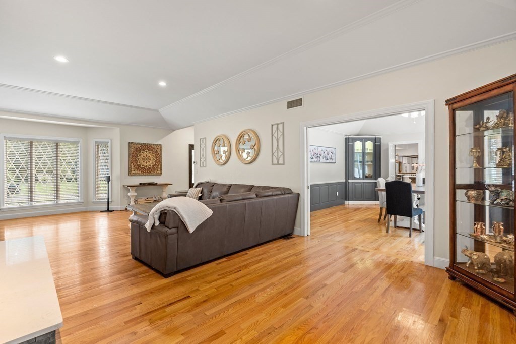 3 Burnham Lane Danvers, MA 01923 - Photo 11 of 41 a spacious bedroom with a bed and wooden floor