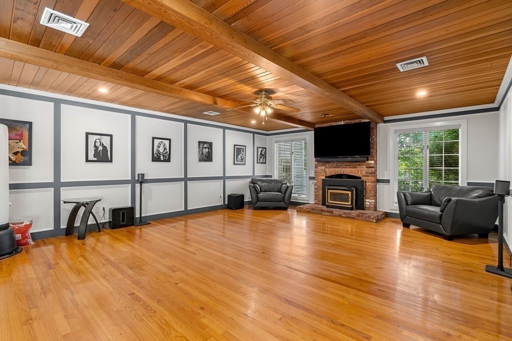 3 Burnham Lane Danvers, MA 01923 - Photo 17 of 41 a view of a livingroom with furniture and a fireplace