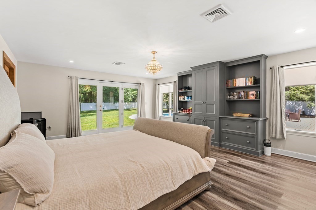 3 Burnham Lane Danvers, MA 01923 - Photo 19 of 41 a bed sitting in a bedroom next to a window