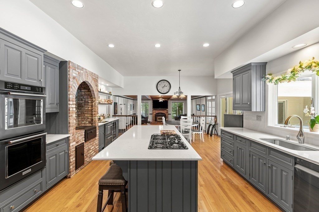 3 Burnham Lane Danvers, MA 01923 - Photo 2 of 41 a large kitchen with sink a stove and cabinets