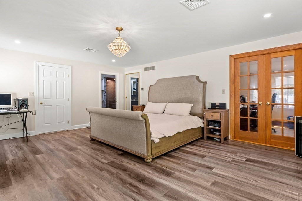 3 Burnham Lane Danvers, MA 01923 - Photo 22 of 41 a bedroom with a bed and a table in it