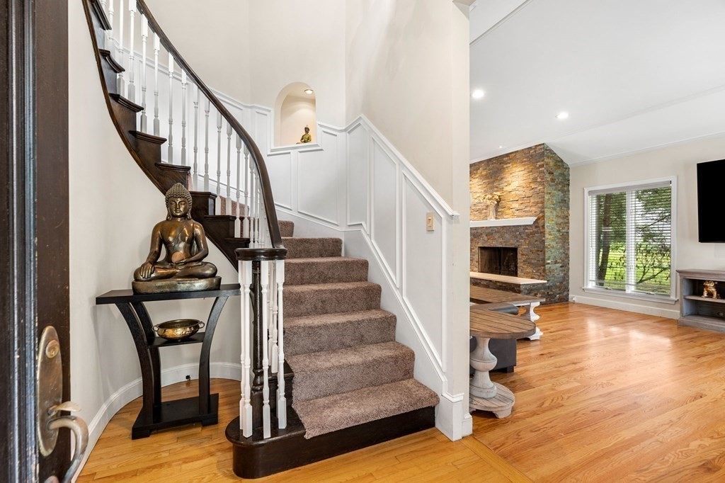 3 Burnham Lane Danvers, MA 01923 - Photo 27 of 41 a view of entryway livingroom and hall with wooden floor
