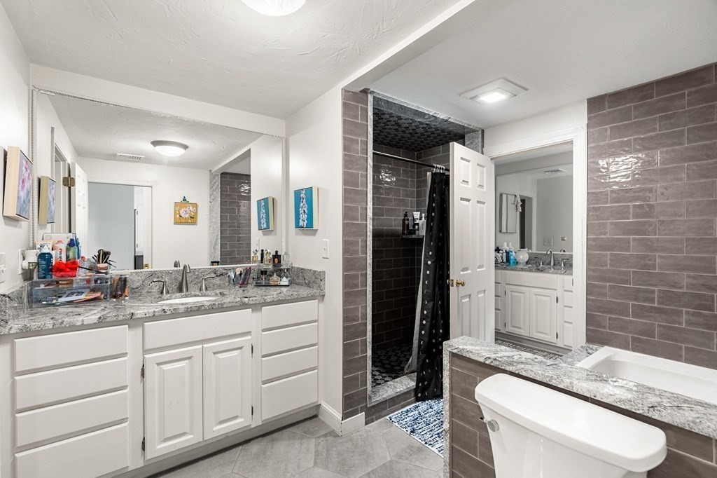 3 Burnham Lane Danvers, MA 01923 - Photo 32 of 41 a bathroom with a sink a toilet and shower