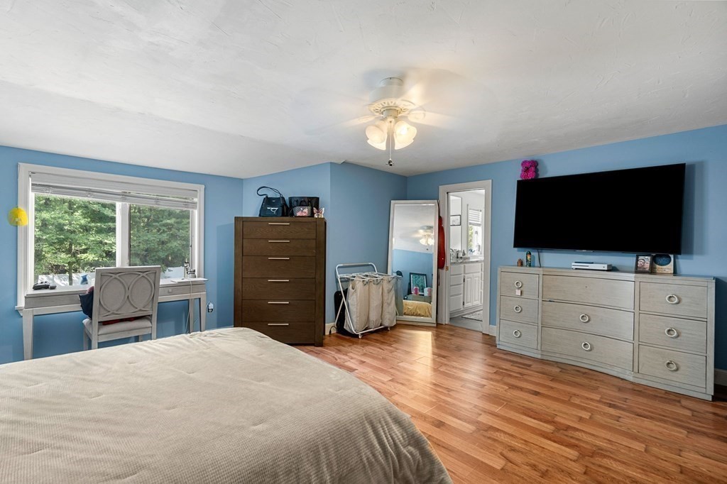 3 Burnham Lane Danvers, MA 01923 - Photo 34 of 41 a bedroom with a bed and a flat screen tv