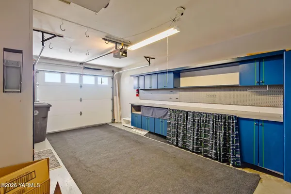 a view of a livingroom with a ceiling fan and window