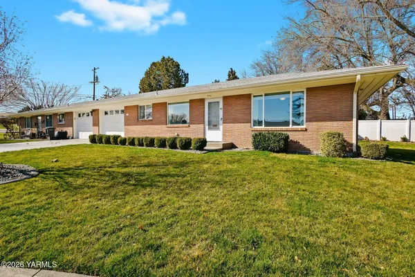a view of a patio with couches chairs and potted plants