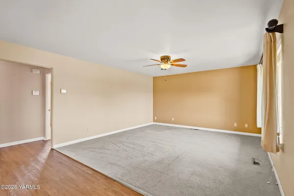 a view of an empty room with a window