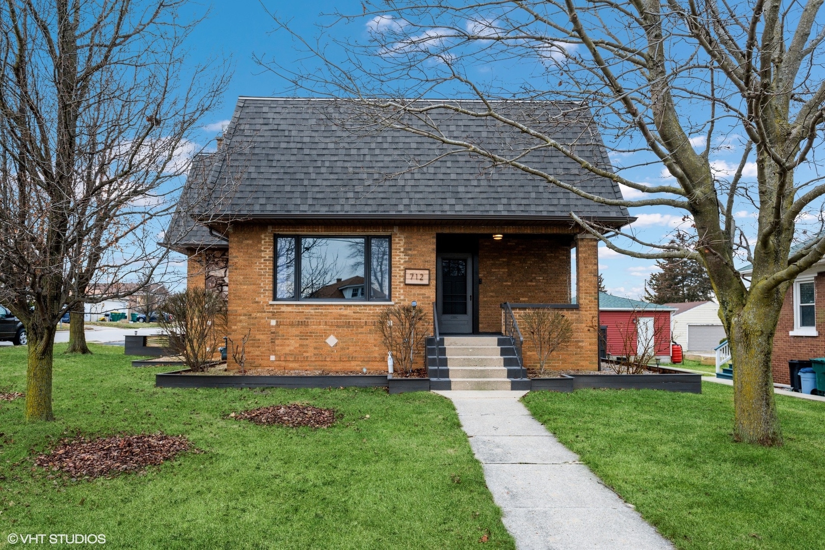a front view of a house with garden