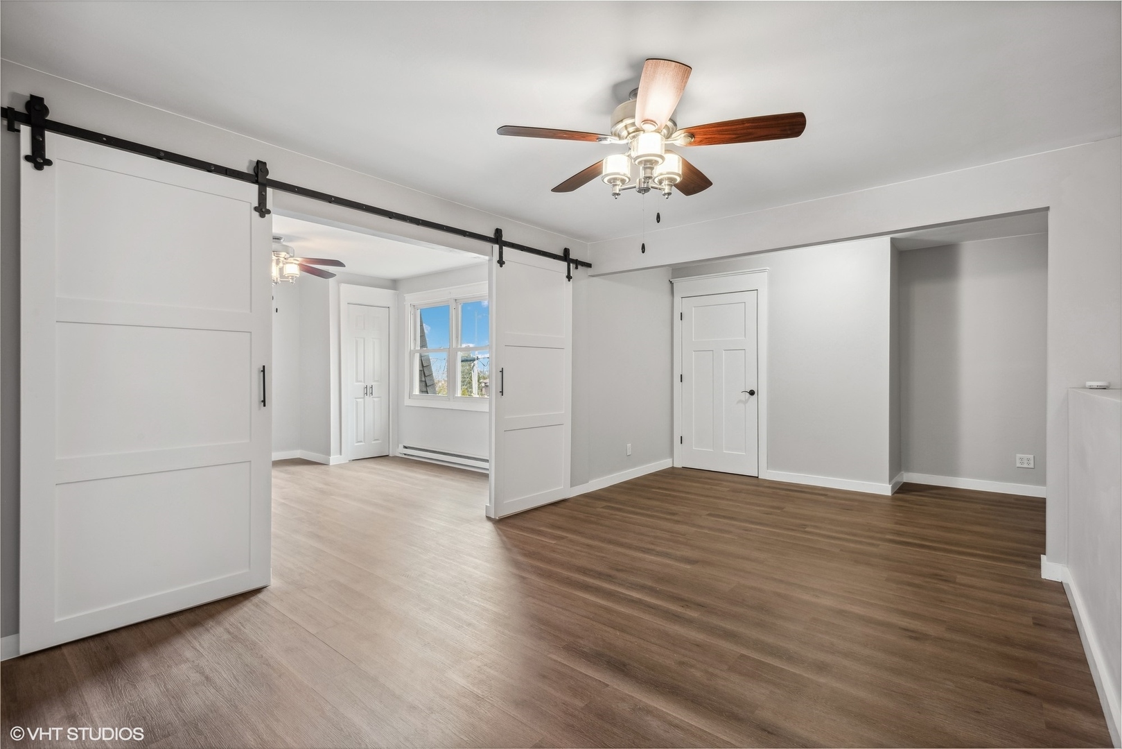 712 McCarthy Road Lemont, IL 60439 - Photo 11 of 24 a view of an empty room with wooden floor