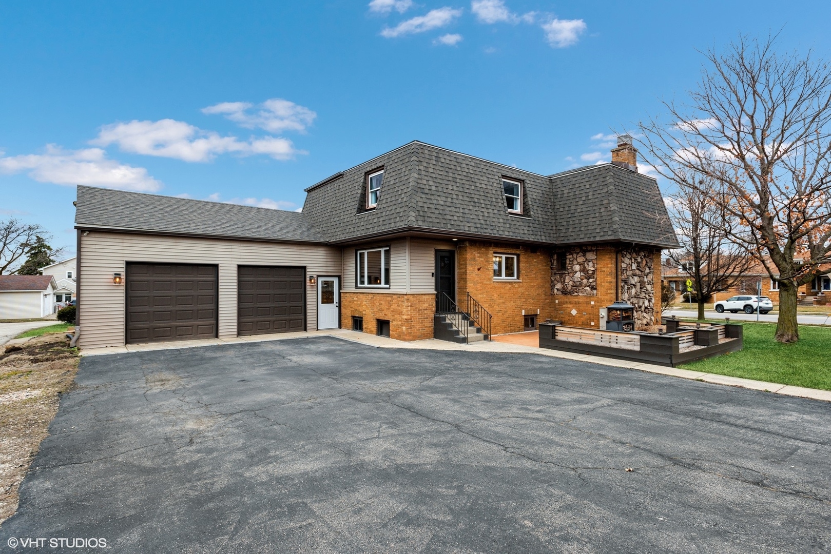 712 McCarthy Road Lemont, IL 60439 - Photo 3 of 24 a front view of a house with a yard and garage