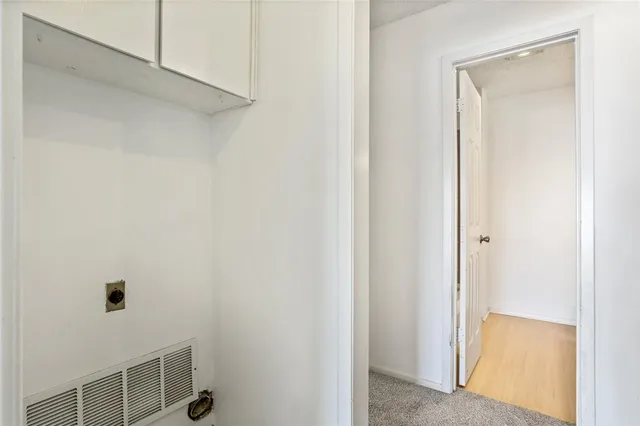 a view of a hallway with front door