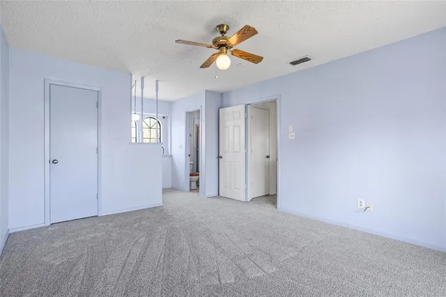 a bathroom with a granite countertop sink a large mirror and a window