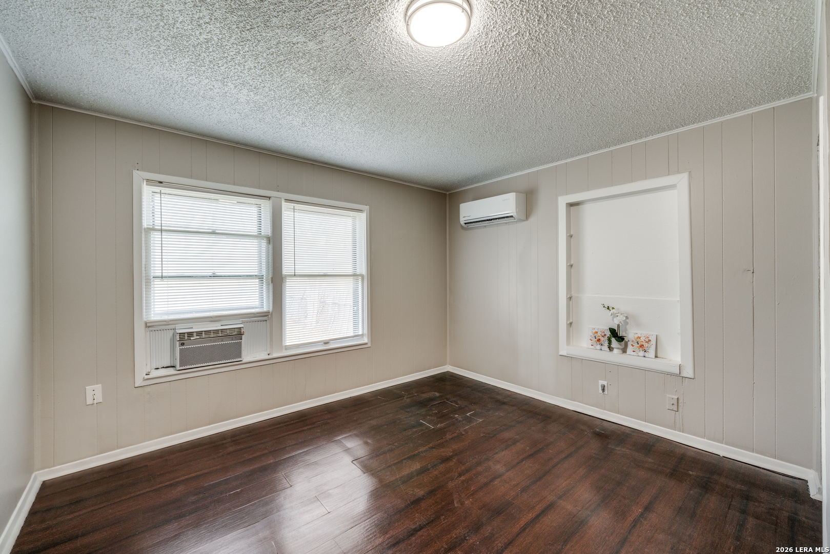 2307 Basse Road San Antonio, TX 78213 - Photo 13 of 17 an empty room with wooden floor and windows