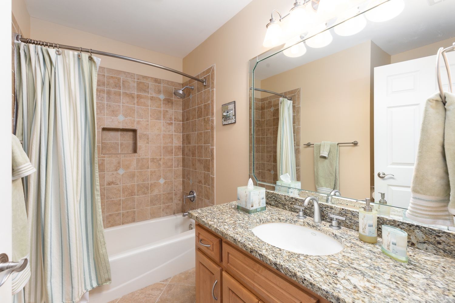 6326 Arno Road Franklin, TN 37064 - Photo 35 of 67 a bathroom with a granite countertop sink and a mirror