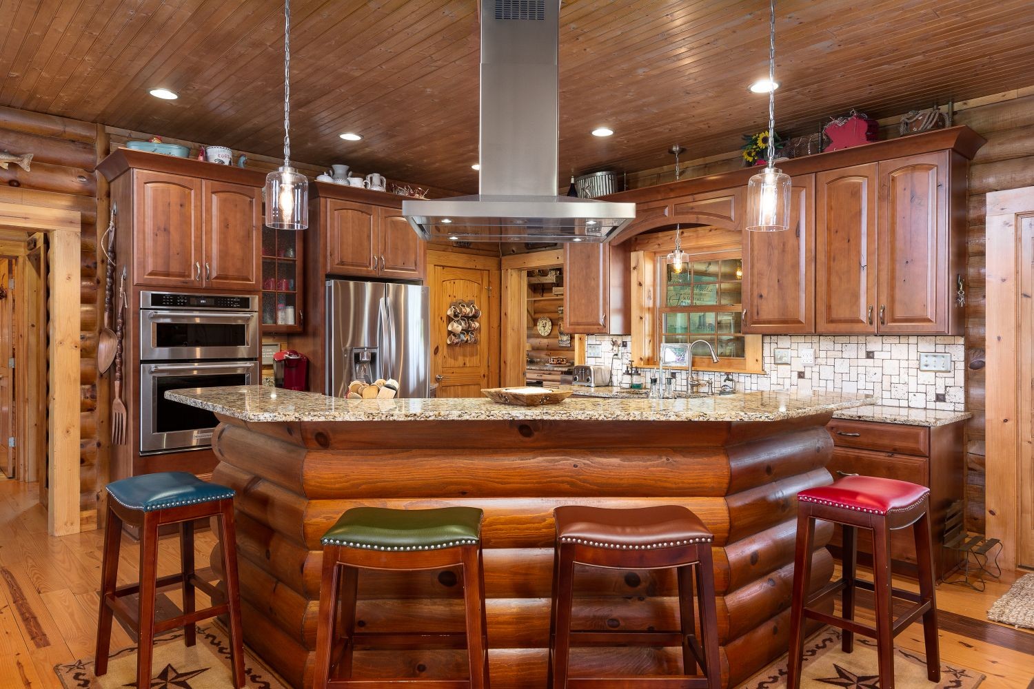 6326 Arno Road Franklin, TN 37064 - Photo 48 of 67 a kitchen with a table chairs stove and cabinets