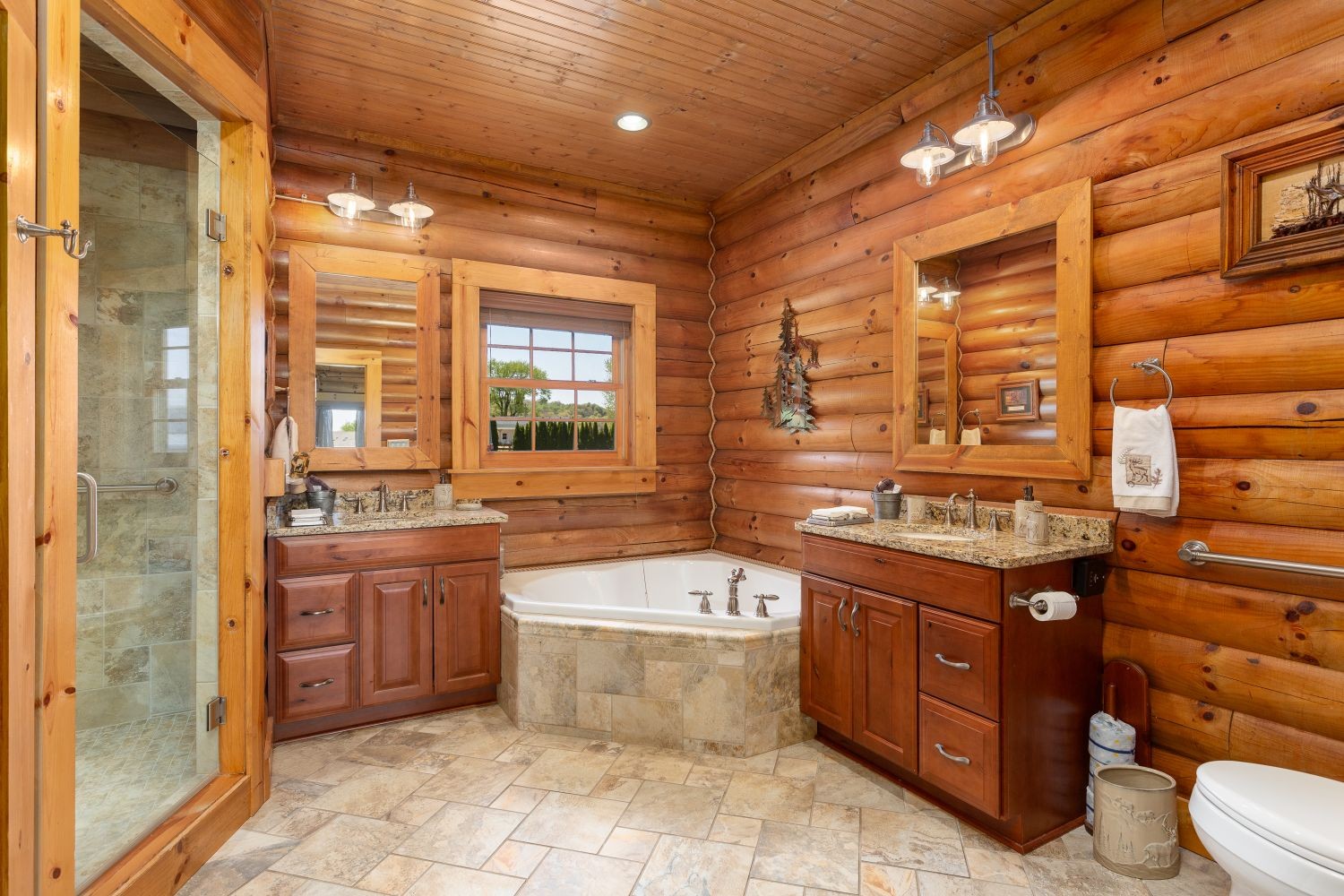 6326 Arno Road Franklin, TN 37064 - Photo 54 of 67 a spacious bathroom with a granite countertop toilet sink and mirror