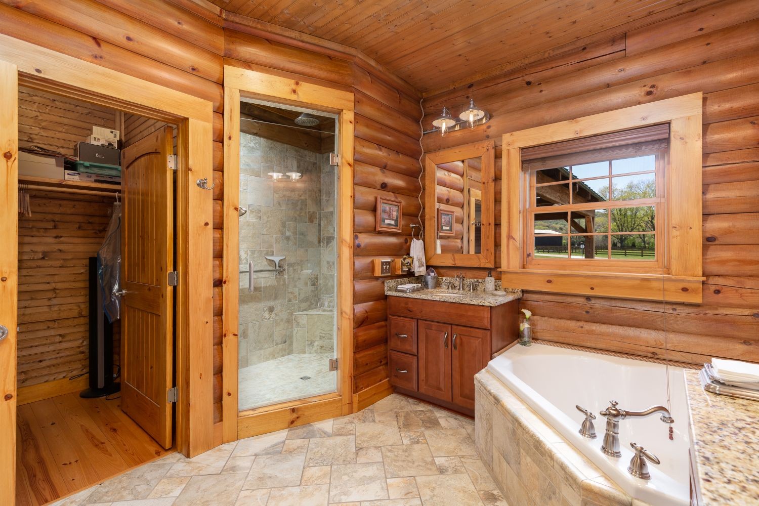 6326 Arno Road Franklin, TN 37064 - Photo 55 of 67 a bathroom with a tub a sink and a shower