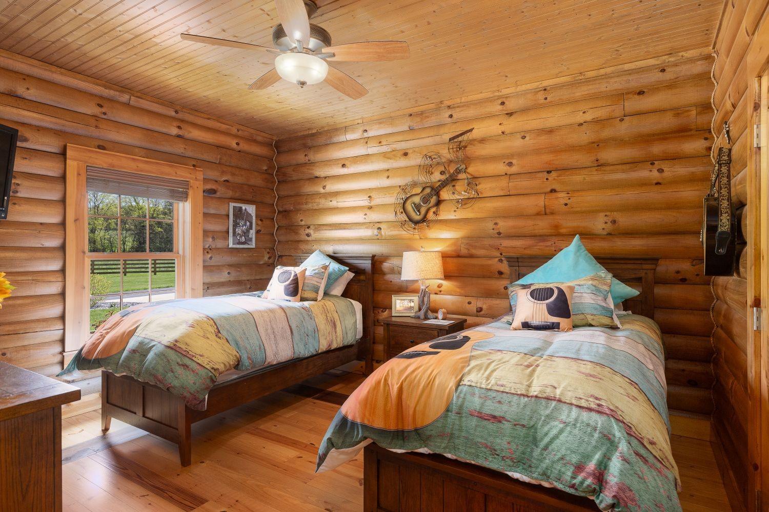 6326 Arno Road Franklin, TN 37064 - Photo 56 of 67 a bedroom with two beds and a chandelier