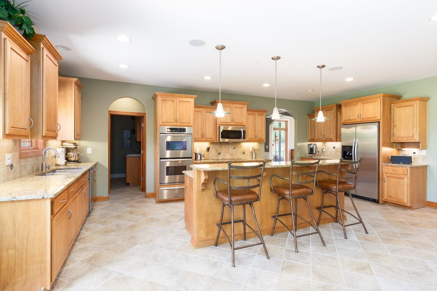 6326 Arno Road Franklin, TN 37064 - Photo 8 of 67 a large kitchen with a table and chairs