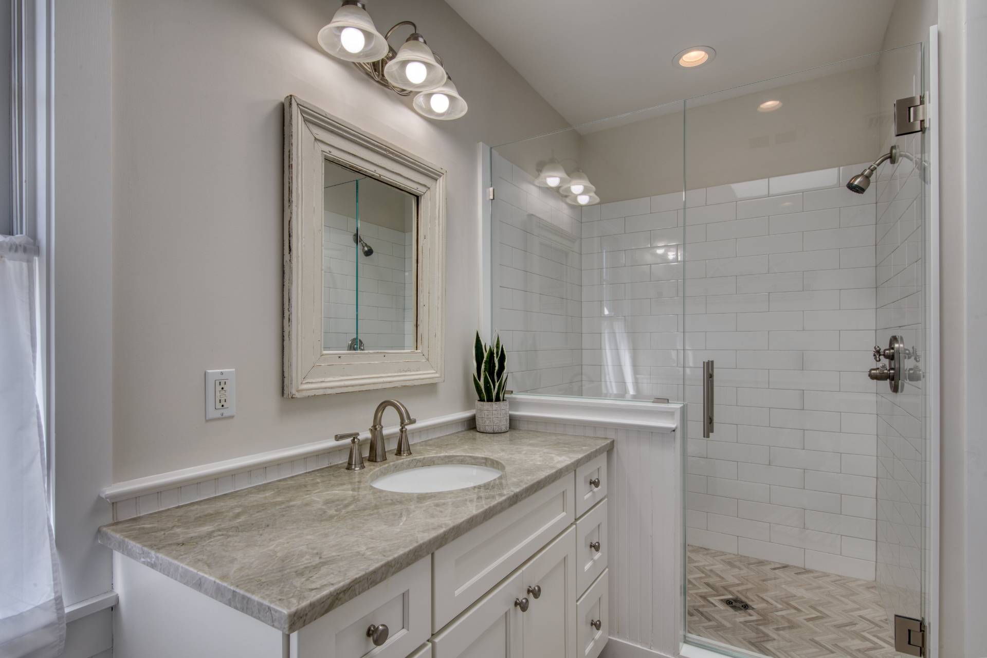 6 Wills Point Road Montauk, NY 11954 - Photo 6 of 16 a bathroom with a granite countertop sink and a mirror