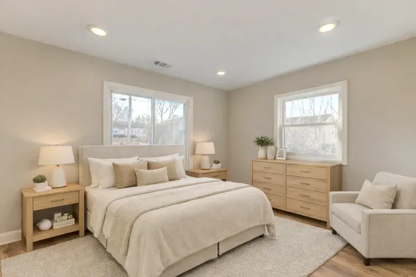 a bedroom with a bed and a couch