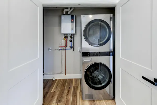 a view of a hallway with washer and dryer