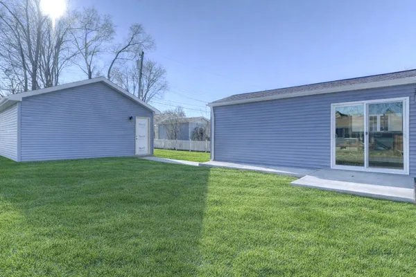 a backyard of a house with lots of green space