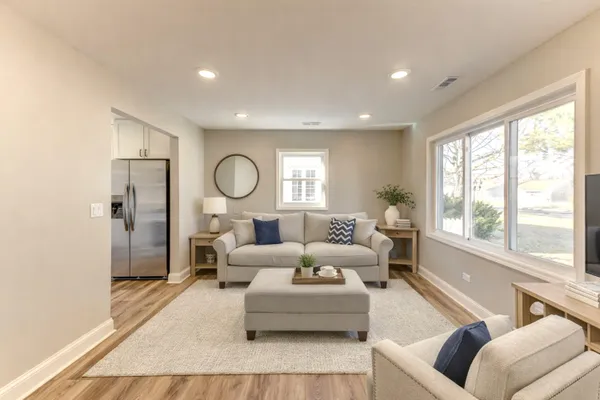 a living room with furniture and a large window