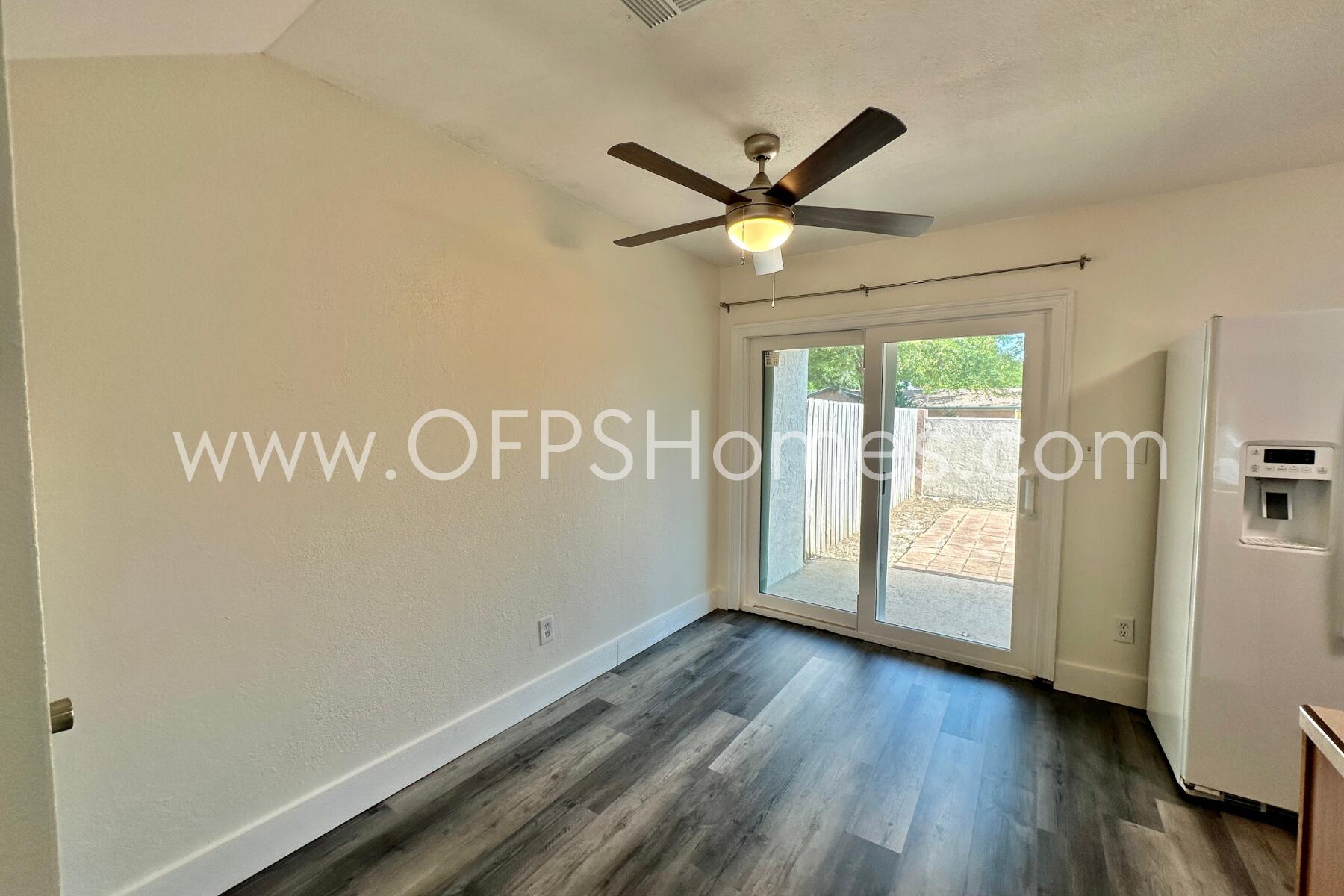 710 Legion Drive, Unit O2 Destin, FL 32541 - Photo 3 of 15 a view of empty room with wooden floor and fan