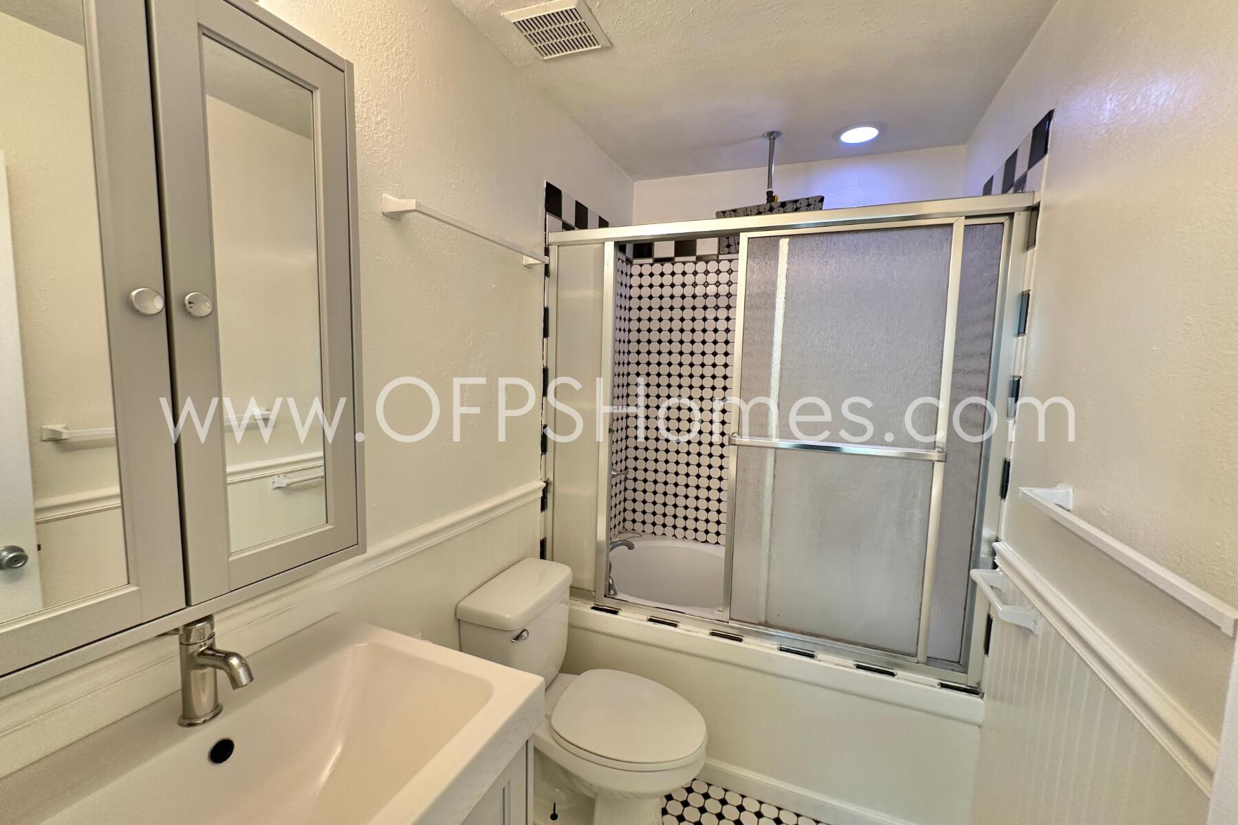 710 Legion Drive, Unit O2 Destin, FL 32541 - Photo 9 of 15 a bathroom with a sink toilet and shower