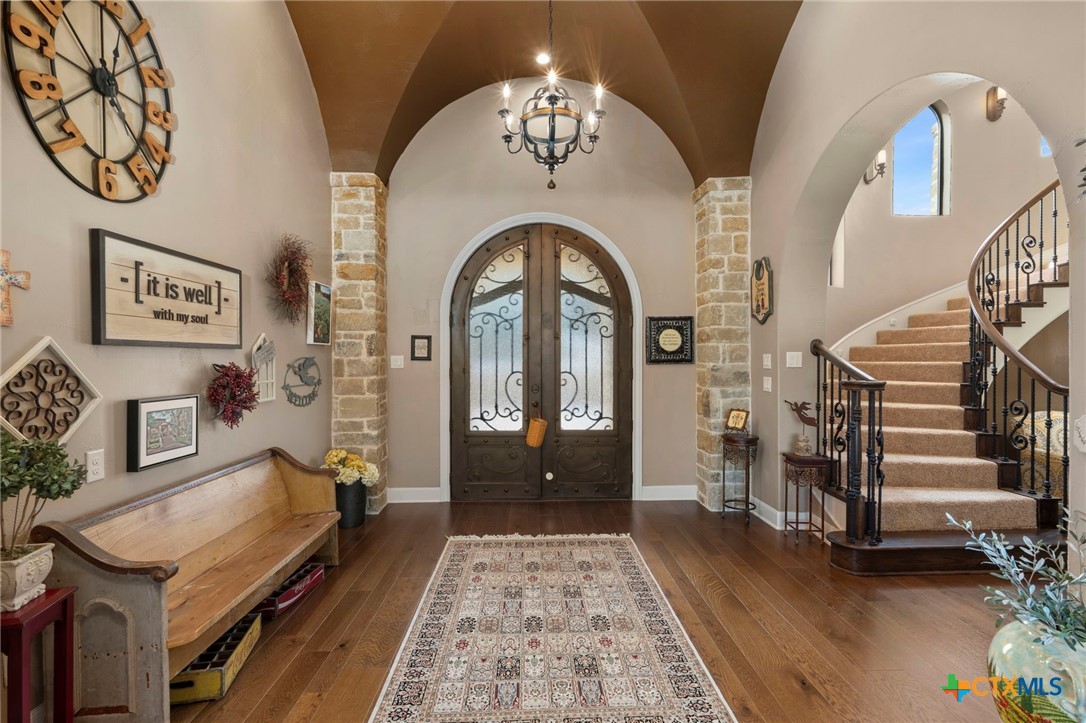 1039 Bluewater Place Spring Branch, TX 78070 - Photo 7 of 48 a view of a hallway with entryway wooden floor and front door