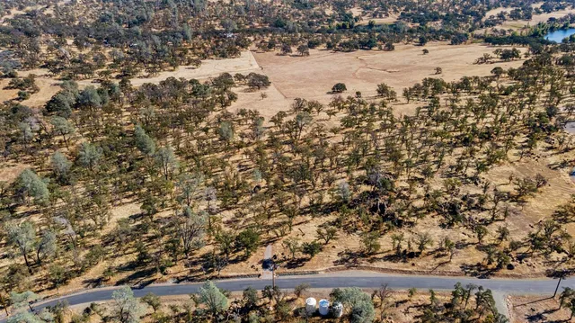 a view of a large building with wooden fence