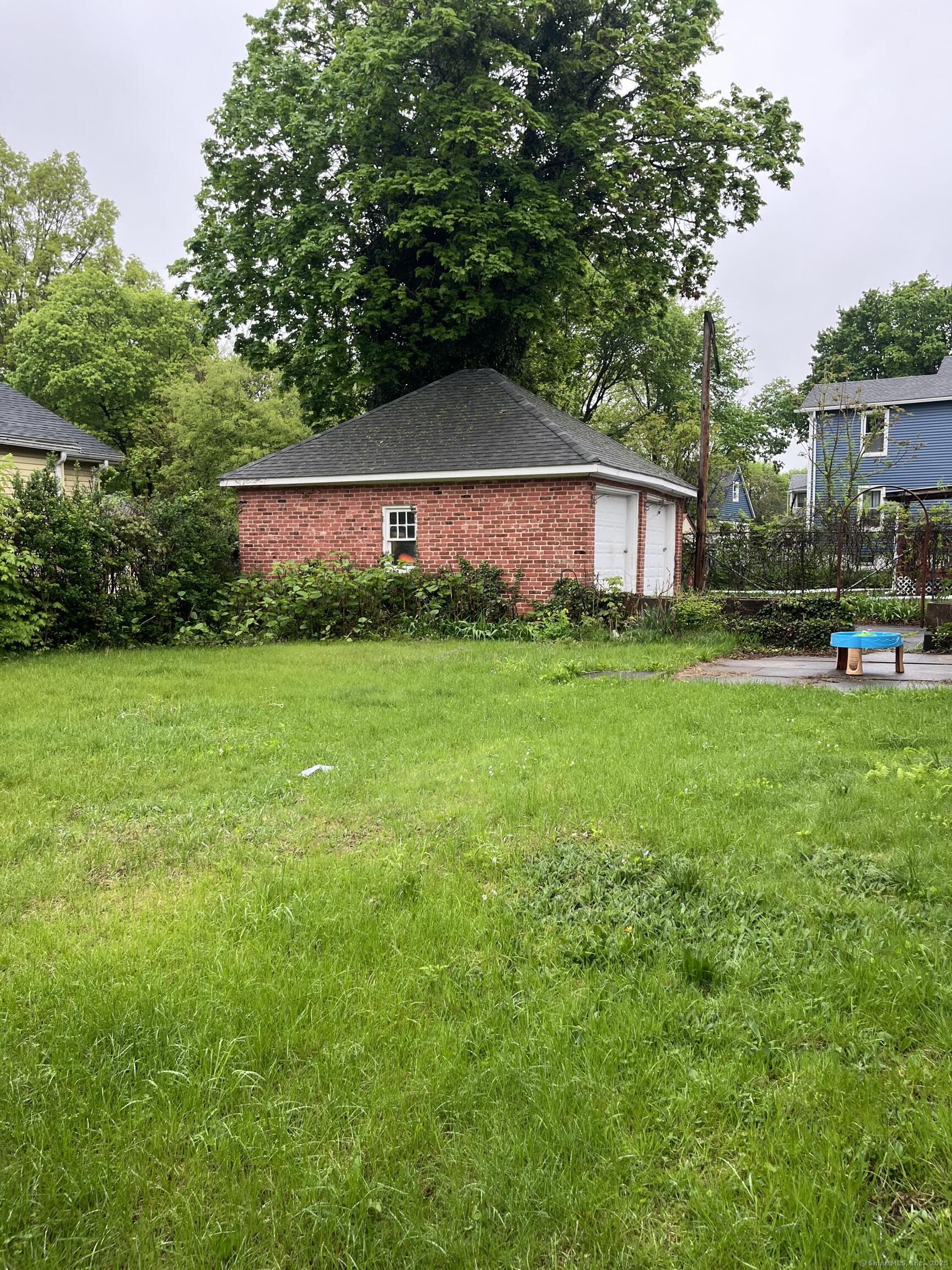 235 Grove Street Meriden, CT 06451 - Photo 2 of 3 a view of a house with a yard