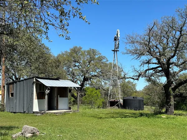 a view of a field with an ocean view