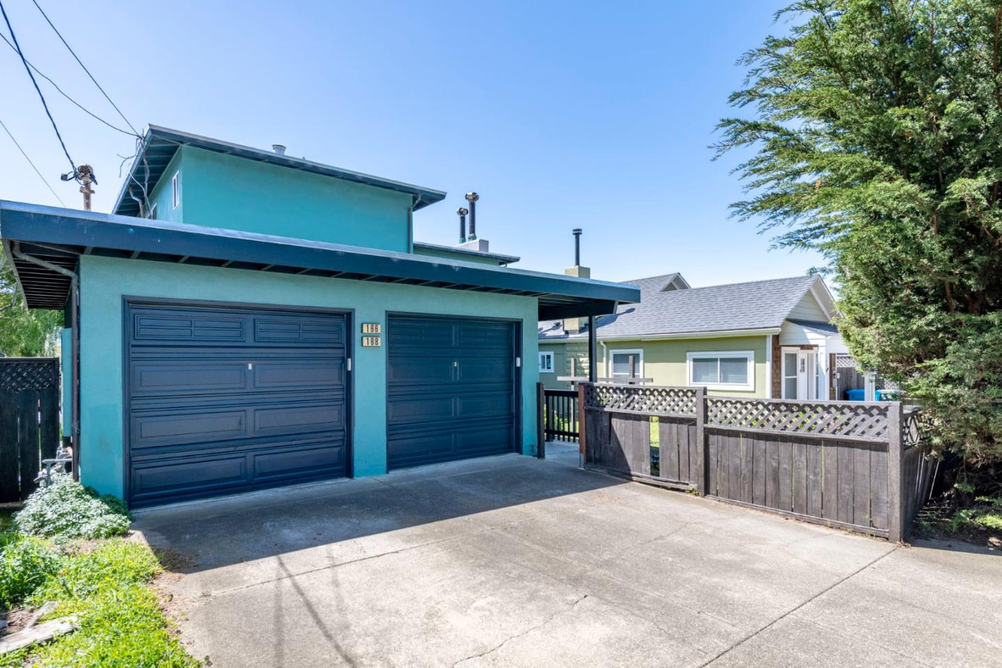 168 Salada Avenue Pacifica, CA 94044 - Photo 11 of 12 a view of a house with a garage and yard